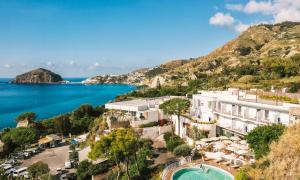 a view of a hotel and the ocean at Hotel San Giorgio Terme in Ischia