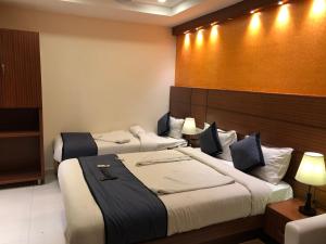 Katil atau katil-katil dalam bilik di HOTEL SPARK RESIDENCY