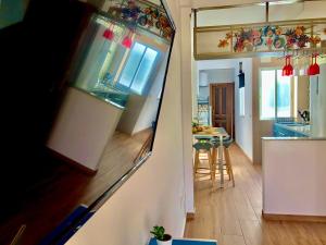 Kuchyň nebo kuchyňský kout v ubytování Apartamentos Puerta Real Sevilla