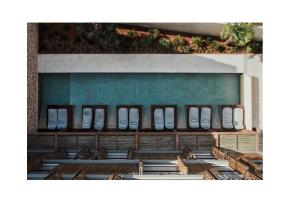 a group of benches in front of a building at OKU Ibiza in San Antonio