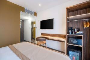 Postel nebo postele na pokoji v ubytování Quality Hotel Toulouse Centre + 22 fotografií