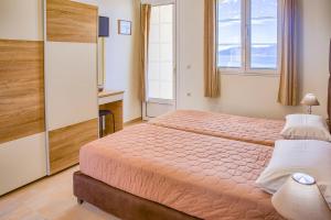 Posteľ alebo postele v izbe v ubytovaní Haraki Sand Beach