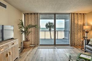 a living room with a view of the ocean at Chic Myrtle Beach Seaside Escape with Pool Access! in Myrtle Beach