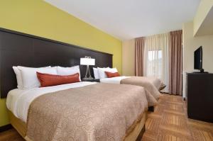 Postel nebo postele na pokoji v ubytování Staybridge Suites Tomball by IHG
