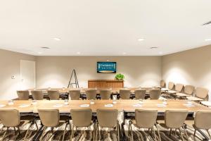 a large conference room with a large table and chairs at Staybridge Suites - Naples - Marco Island by IHG in Naples +37 photos
