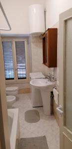 a bathroom with a sink and a toilet at La Fontana in Spoleto +39 photos