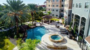 an aerial view of a swimming pool in a resort at Staybridge Suites Houston-NASA Clear Lake by IHG in Webster