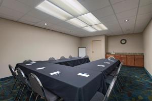 a conference room with a long table and chairs at Candlewood Suites Austin North-Cedar Park, an IHG Hotel in Cedar Park