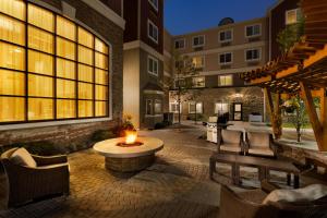 a courtyard with a fire pit in the middle of a building at Staybridge Suites West Edmonton, an IHG Hotel in Edmonton
