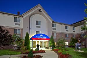 a hotel with a sign that reads cambridge inn at Candlewood Suites Louisville Airport by IHG in Louisville