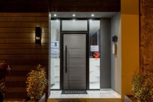 a hallway with a door in a house at Supreme Luxury Suites by Athens Stay in Athens