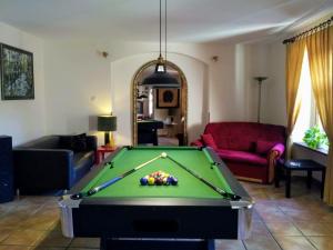 a living room with a pool table at Apartamenty i pokoje gościnne "Wacuś" in Srebrna Góra