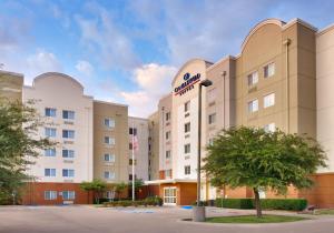 a rendering of the front of a hotel at Candlewood Suites Plano East, an IHG Hotel in Plano