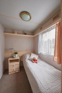 Postel nebo postele na pokoji v ubytování OW Mikomania