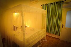 Postel nebo postele na pokoji v ubytování Kanada House Unawatuna