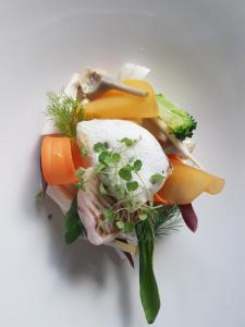 a pile of vegetables on a white background at Hotel et restaurant Le Clos De La Prairie in Gouy-Saint-André +59 photos