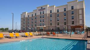 The swimming pool at or close to Candlewood Suites - Frisco, an IHG Hotel