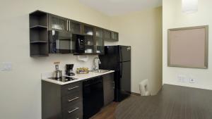 A kitchen or kitchenette at Candlewood Suites - Frisco, an IHG Hotel