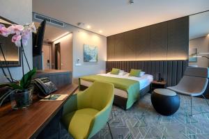 TV a/nebo společenská místnost v ubytování Hunguest Hotel Sóstó