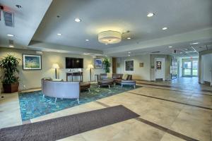 a lobby with couches and chairs in a building at Candlewood Suites Columbus - Grove City, an IHG Hotel in Grove City