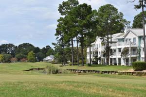 a house on the golf course with a green at Studio Brunswick Plantation Villa 2404L in Calabash +19 photos