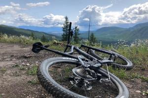 a bike laying on the side of a mountain at Mountain Edge Ski-in Ski-out Condo in Kimberley