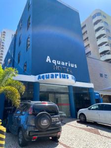 a car parked in front of a building at Hotel Aquarius in Fortaleza