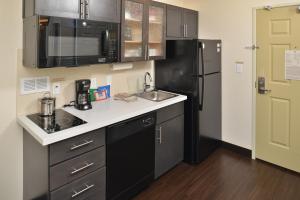 A kitchen or kitchenette at Candlewood Suites Eugene Springfield, an IHG Hotel