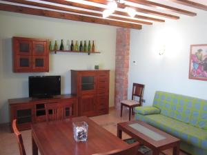 Una televisión o centro de entretenimiento en Apartamentos Almagro