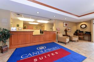 a lobby of a dental office with a canadian smiles sign at Candlewood Suites Elmira Horseheads, an IHG Hotel in Horseheads