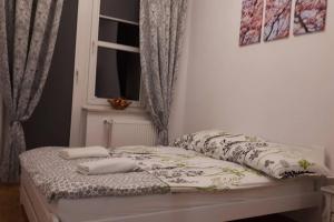 Postel nebo postele na pokoji v ubytování Apartament Oliwkowy