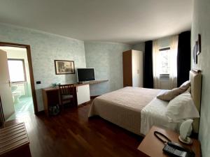 TV a/nebo společenská místnost v ubytování Sole della Franciacorta - Hotel & Restaurant