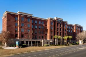 a large brick building with a road in front of it at Staybridge Suites Columbia, an IHG Hotel in Columbia
