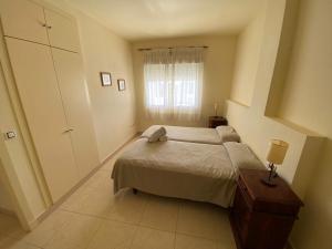 Posteľ alebo postele v izbe v ubytovaní Apartamento en Bahia Golf - Costa Ballena