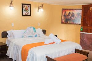 Rúm í herbergi á Hotel Kuntur Wassi