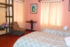 Rúm í herbergi á Hotel Kuntur Wassi