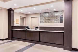 a lobby of a hospital with a reception desk at Candlewood Suites Eau Claire I-94, an IHG Hotel in Eau Claire