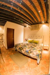 Postel nebo postele na pokoji v ubytování Hotel Mesón de los Remedios