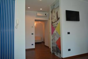 TV a/nebo společenská místnost v ubytování Una Casa al Belvedere