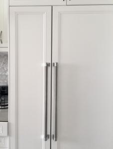 a white refrigerator with two doors in a kitchen at Comfortable private space in Pickering
