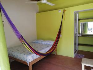 Posteľ alebo postele v izbe v ubytovaní Mazunte Posada Sun Dance
