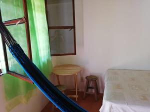 Säng eller sängar i ett rum på Mazunte Posada Sun Dance
