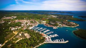 an aerial view of a harbor with boats in the water at Martina Apartments in Funtana