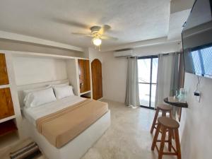 Katil atau katil-katil dalam bilik di MIO Cancún Hotel Boutique