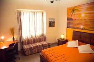 A bed or beds in a room at Posada Tambuca