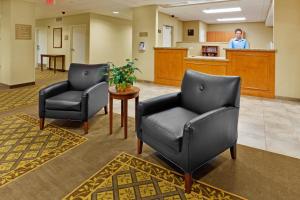 two chairs and a table in a waiting room at Candlewood Suites Hazleton, an IHG Hotel in Hazleton