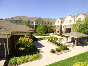 an aerial view of a building with a courtyard at Staybridge Suites Detroit-Novi, an IHG Hotel in Novi