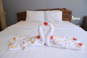 Postel nebo postele na pokoji v ubytování BK Hotel