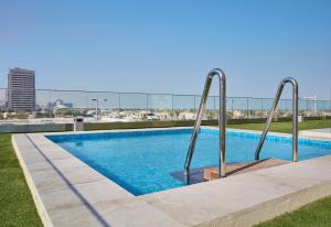 The swimming pool at or close to Staybridge Suites - Doha Lusail by IHG