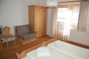 Łóżko lub łóżka w pokoju w obiekcie Pension Marienhof